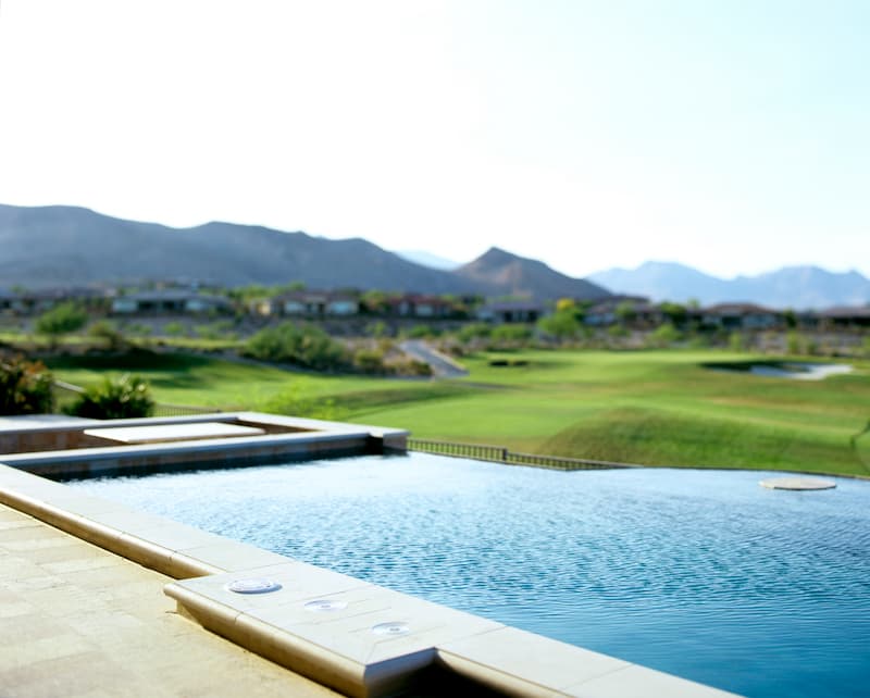 Las Vegas Golf Community. Pool over looking golf course with mountains in background.